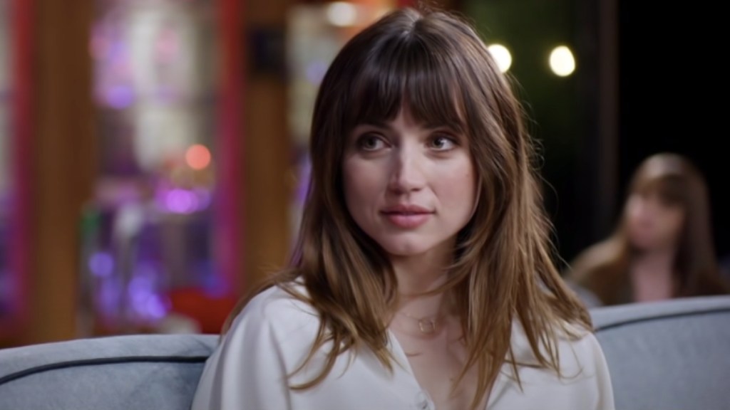 Ana de Armas looking at Jack as he sings The Beatles' Something in Yesterday