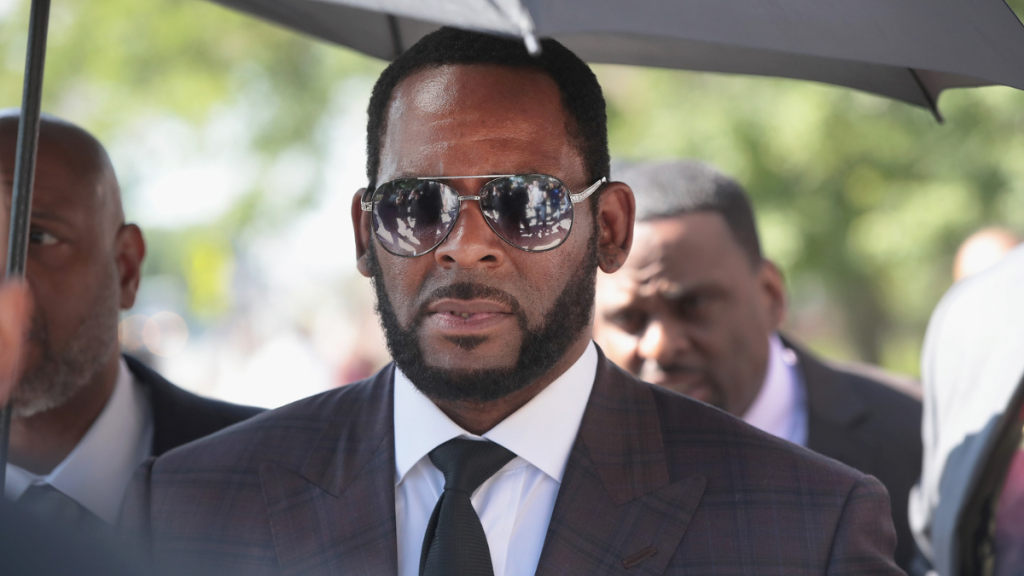 R Kelly's crimes, for which he is in jail today with a release date in 2045, include sex trafficking, racketeering, and other charges