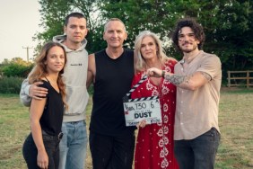 The cast of Out of the Dust stands in a field.