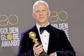 Ryan Murphy holds a Golden Globe.