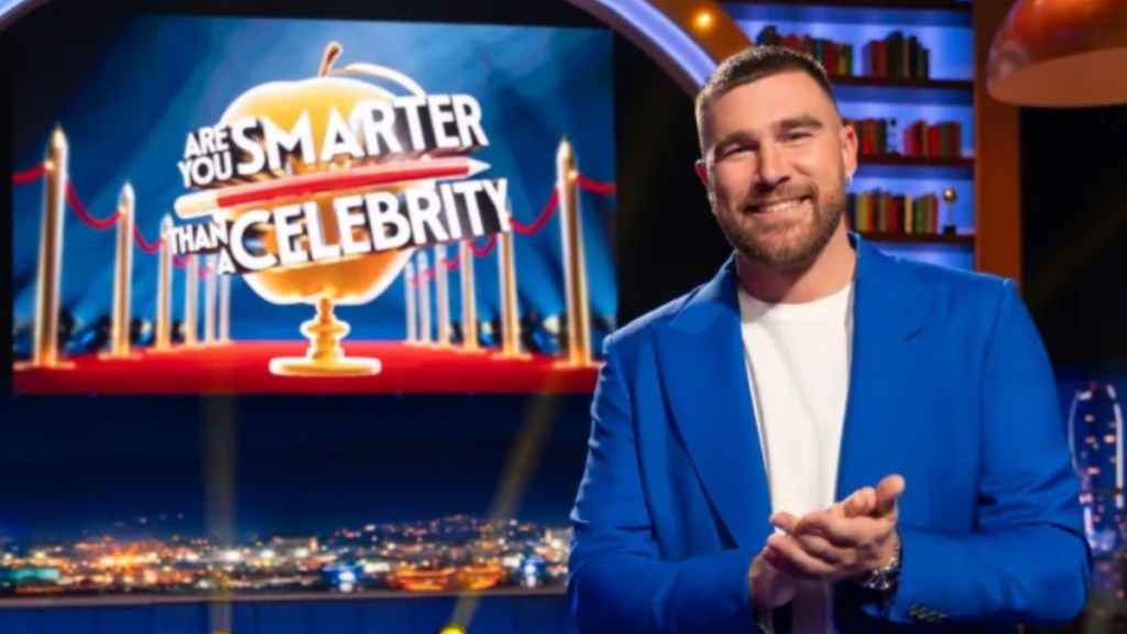 Travis Kelce stands in Are You Smarter Than a Celebrity?