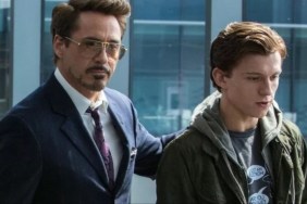 Robert Downey Jr. puts his hand on Tom Holland’s shoulder.