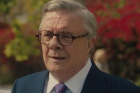 Nathan Lane stands and stares in confusion.