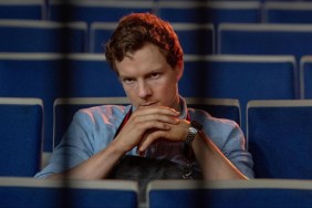 Patrick Gibson sits with his hands under chin.