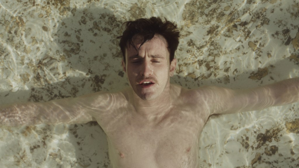 Paul Mescal as Lionel soaking in water in The History of Sound