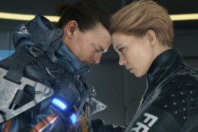 A man and woman place their heads against one another.