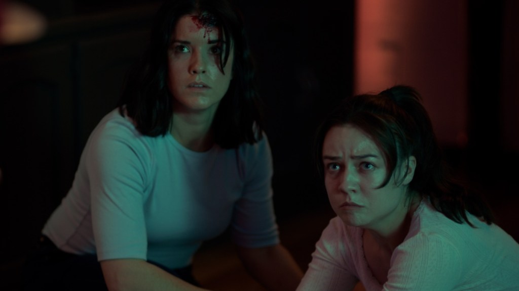 Two women look concered in Morgan: Killer Doll.